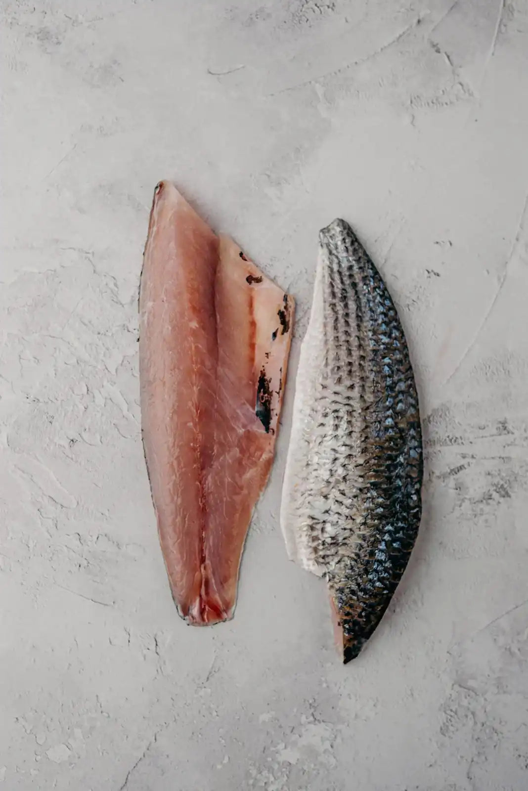 Fish meat fillets, pink and silver skin-on pieces