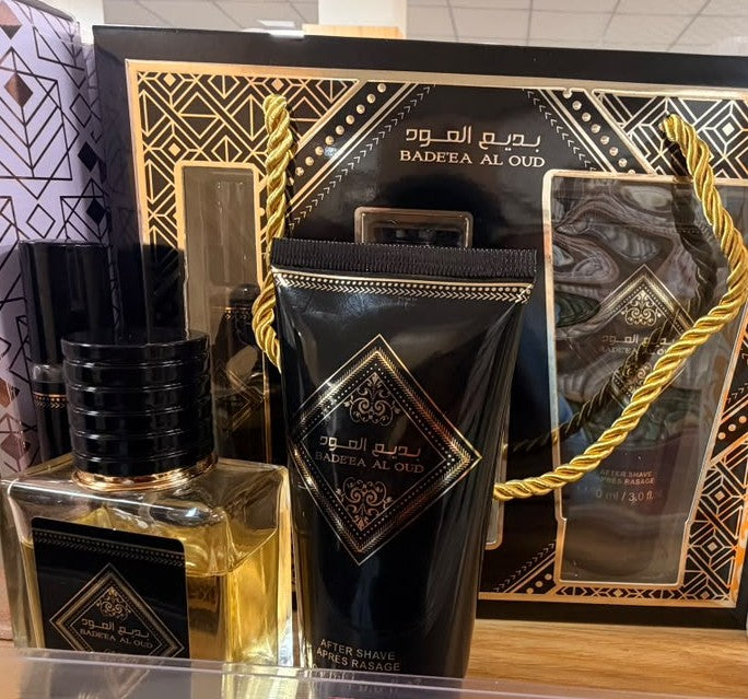 BADE'EA AL OUD fragrance gift set with black-and-gold perfume bottle and gift box
